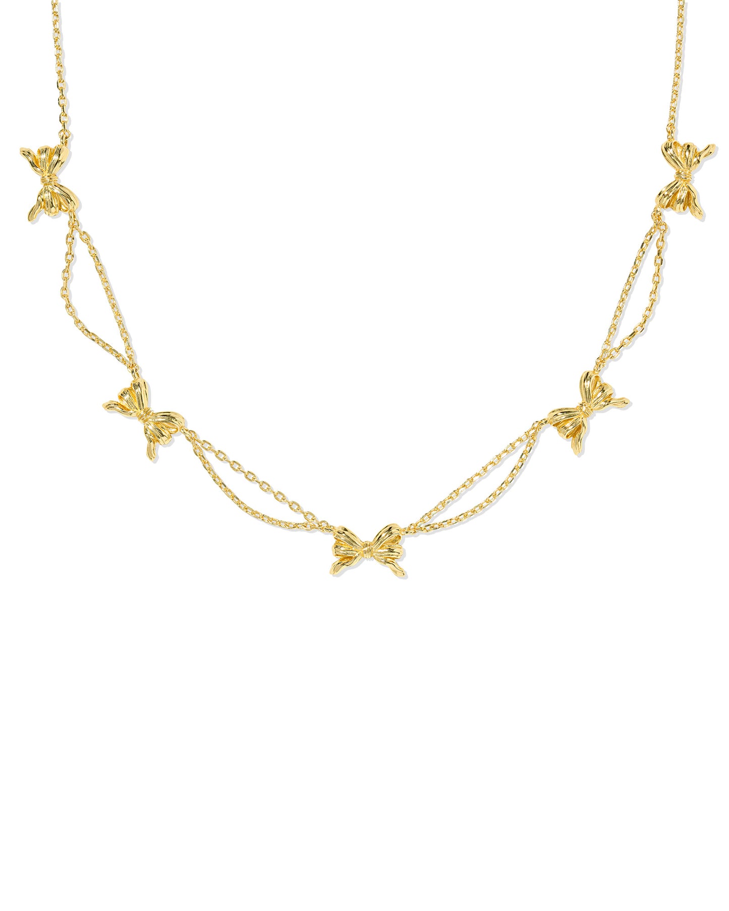 Dainty gold chain with ribbon accents.