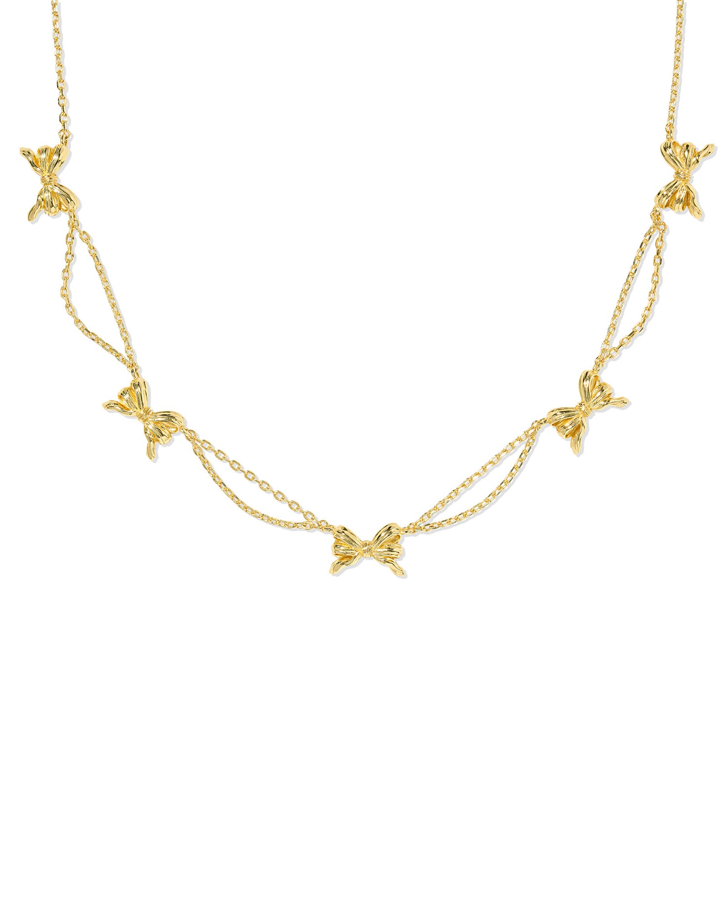 Dainty gold chain with ribbon accents.