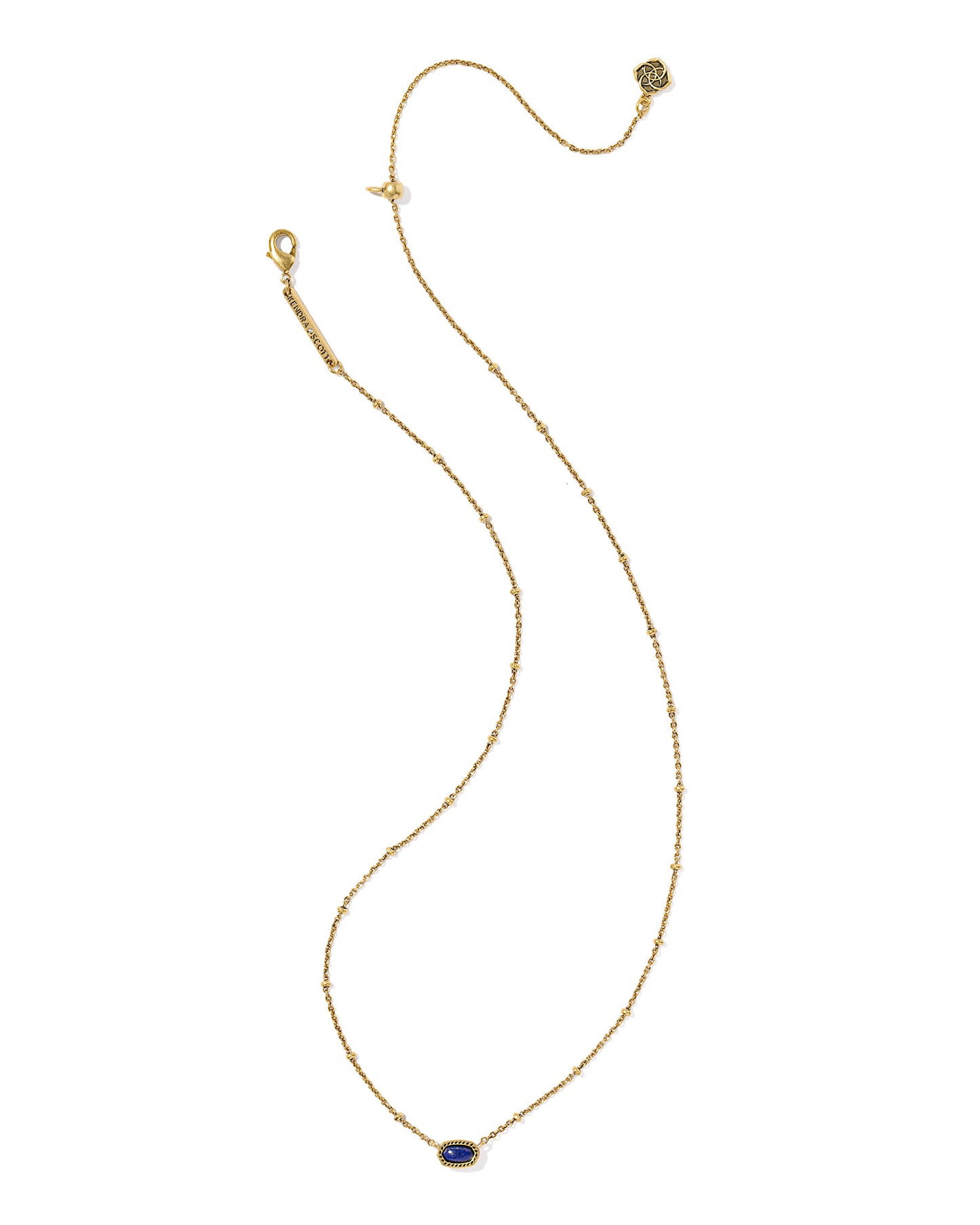 Gold necklace with a oval navy stone pendant, the chain has a small circular details and the pendant is set within a textured gold frame. 