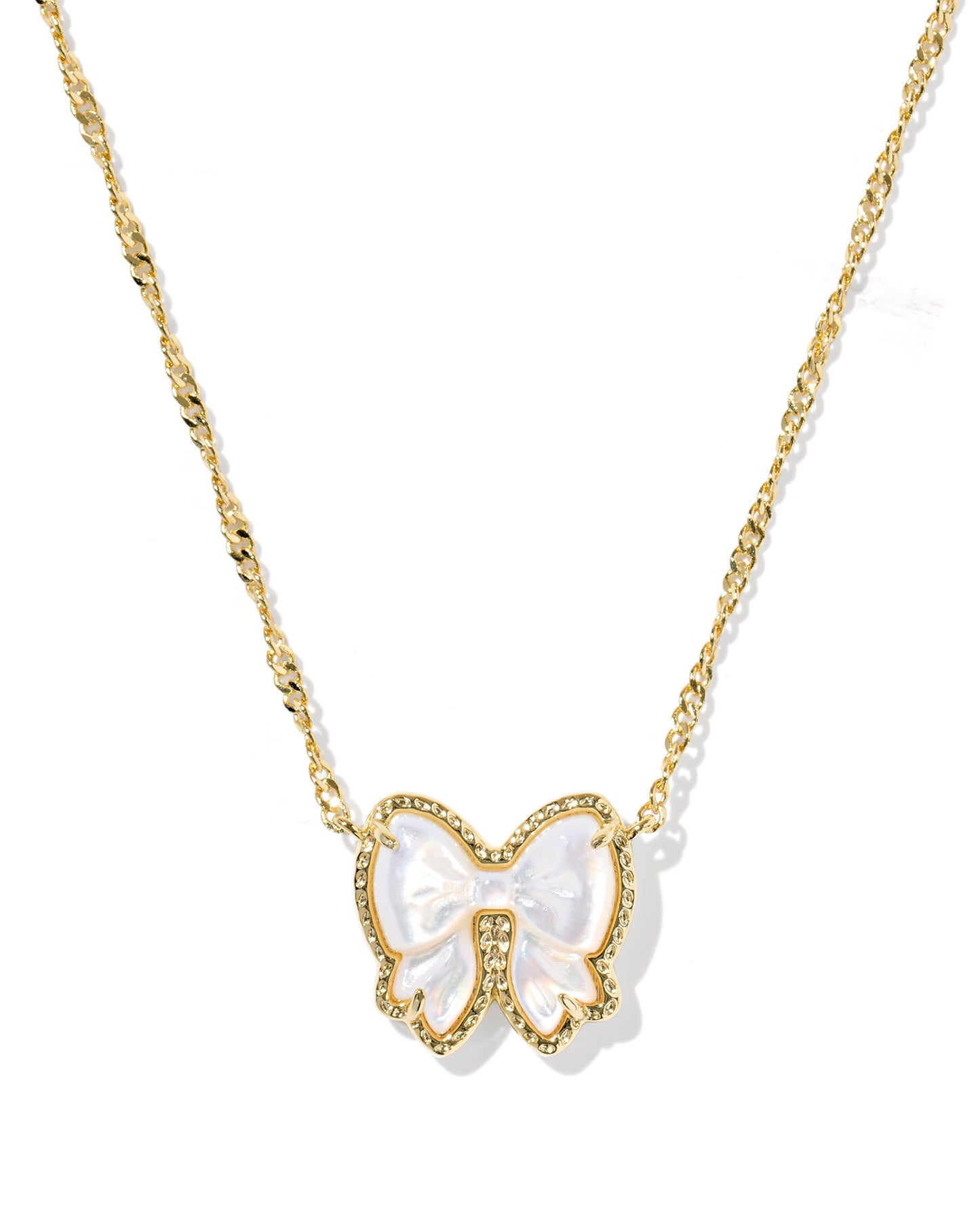 The Haley Gold Bow Short Pendant Necklace. Complete with our signature hoofprint detailing, custom-carved mother-of-pearl, and a reversible pendant for double the styling options
Gold Ivory Mother of Pearl