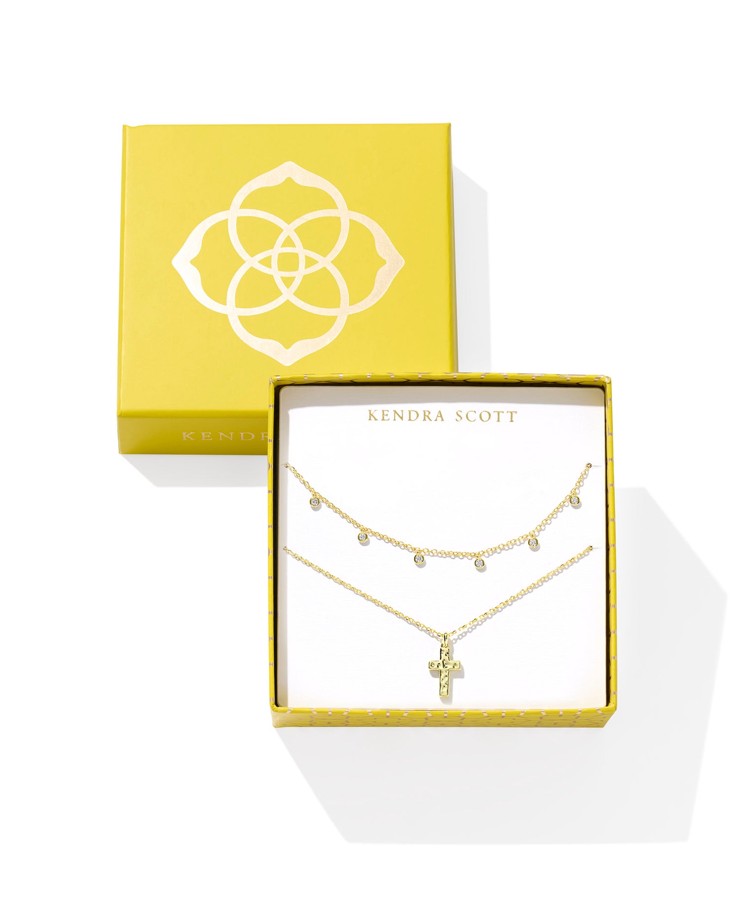 Style a layered look that’s full of sparkle and meaning with the Amelia Gold Cross Necklace Gift Set in White Crystal. Our timeless cross pendant is paired with a textured strand necklace, creating an exclusively priced (and specially wrapped!) pair they’ll love. Set includes the Amelia Chain Necklace and Cross Pendant Necklace.