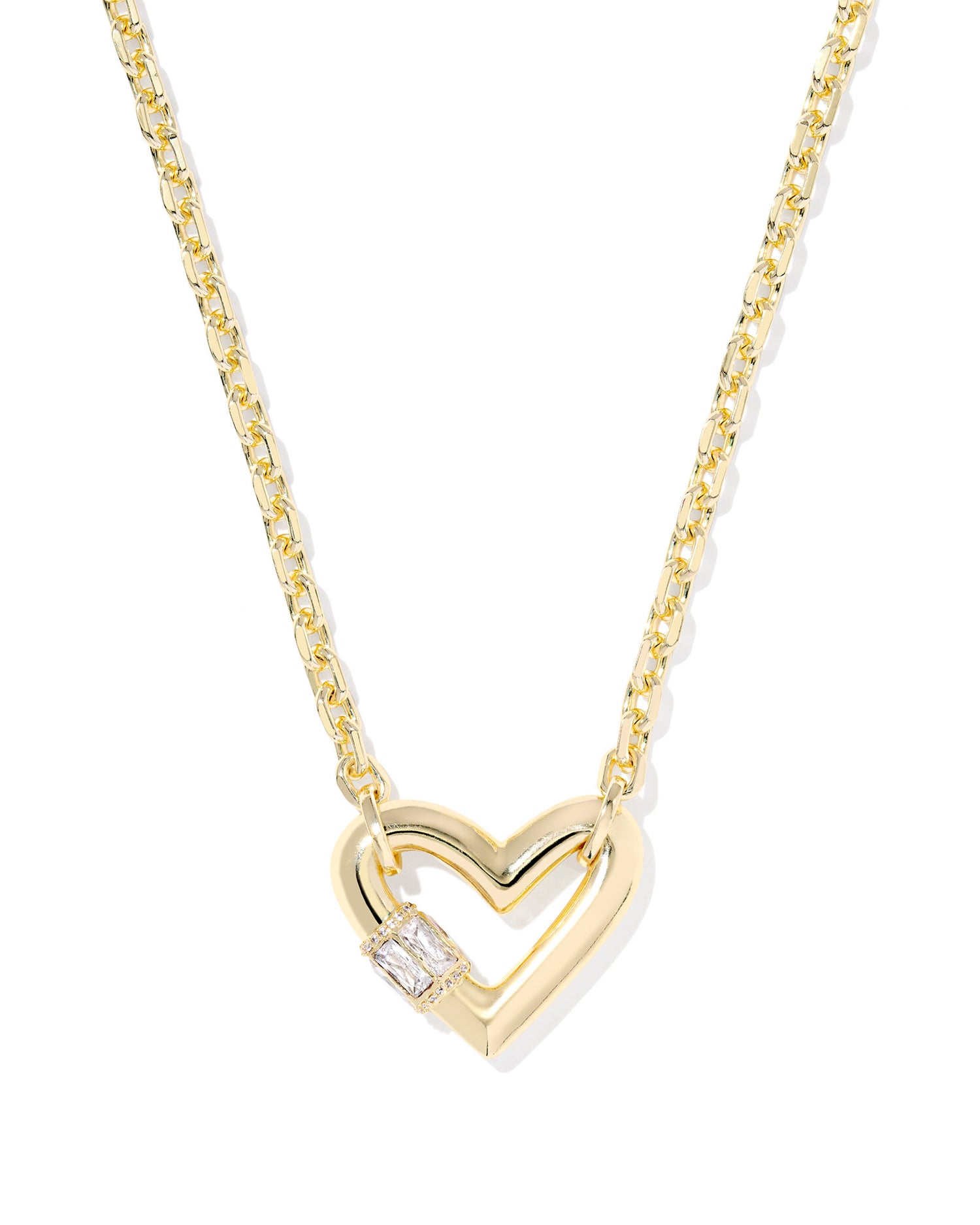 Show some love to your necklace stack with the Emery Heart Gold Short Pendant Necklace. Featuring a bold heart-shaped pendant—inspired by our bestselling Ari silhouette—studded with gorgeous baguette stones for extra sparkle, this necklace is a heartfelt take on the hardware jewelry trend.
Metal- 14k Yellow Gold Over Brass Closure- Lobster Clasp
Size- 16" CHAIN WITH 3" EXTENDER, 0.85"L X 1.03"W PENDANT