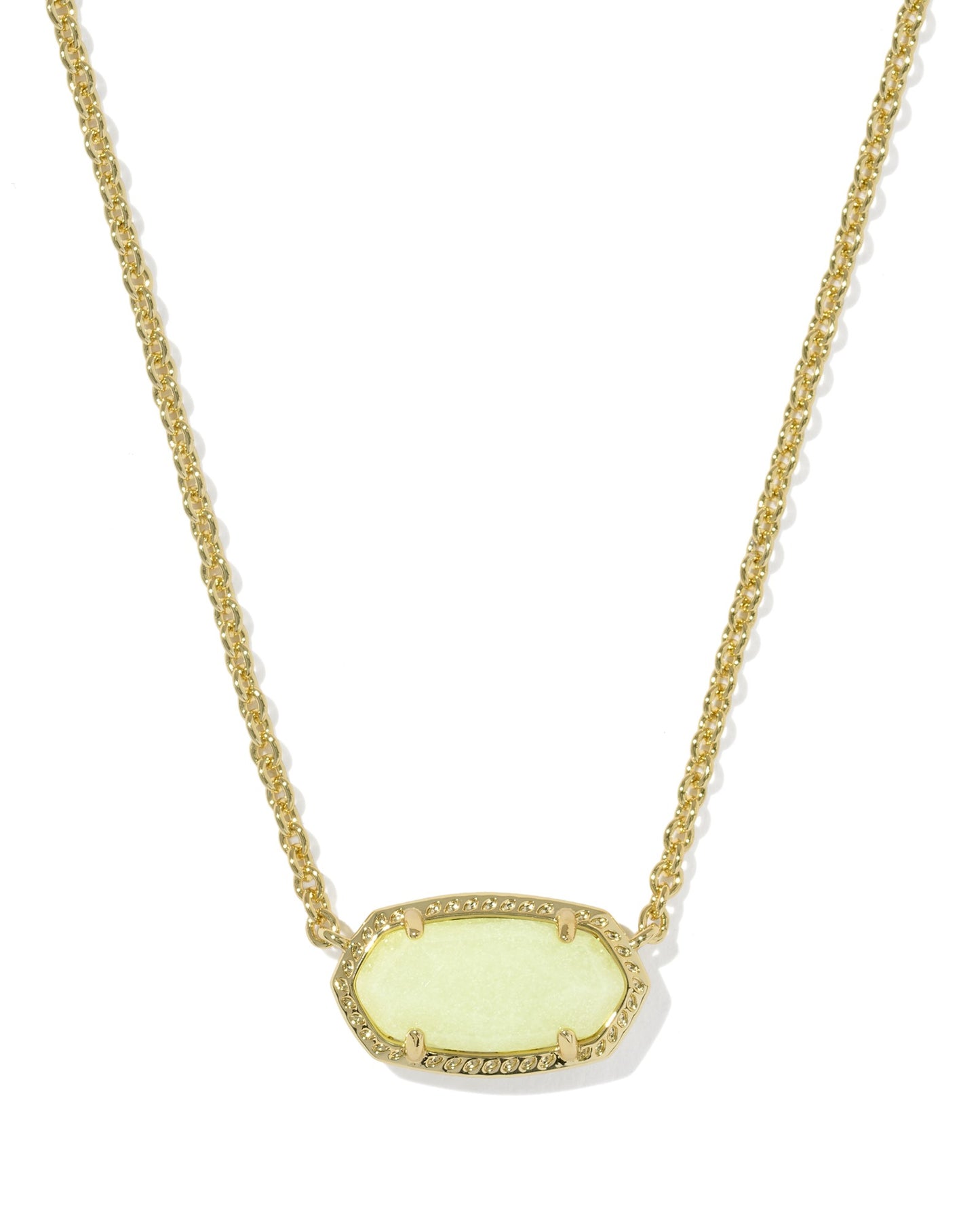 Necklace with a off white pendant on a textured gold frame on a white background