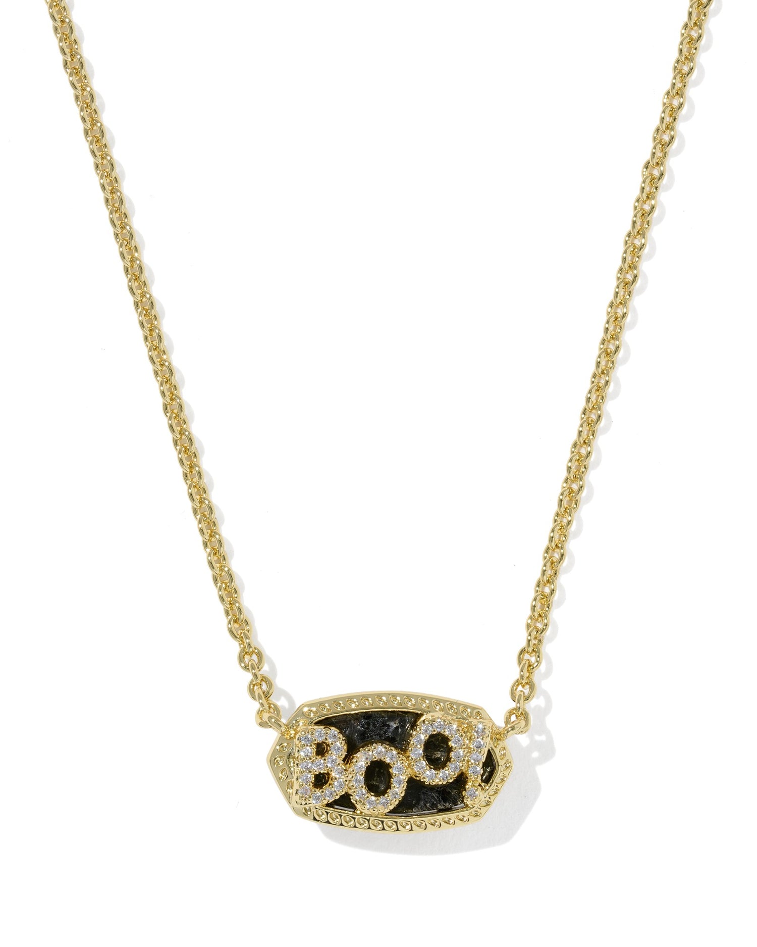 A gold chain necklace with an oval pendant featuring the word 'BOO' in sparkling clear stones over a textured black stone, shown on a clean white background.