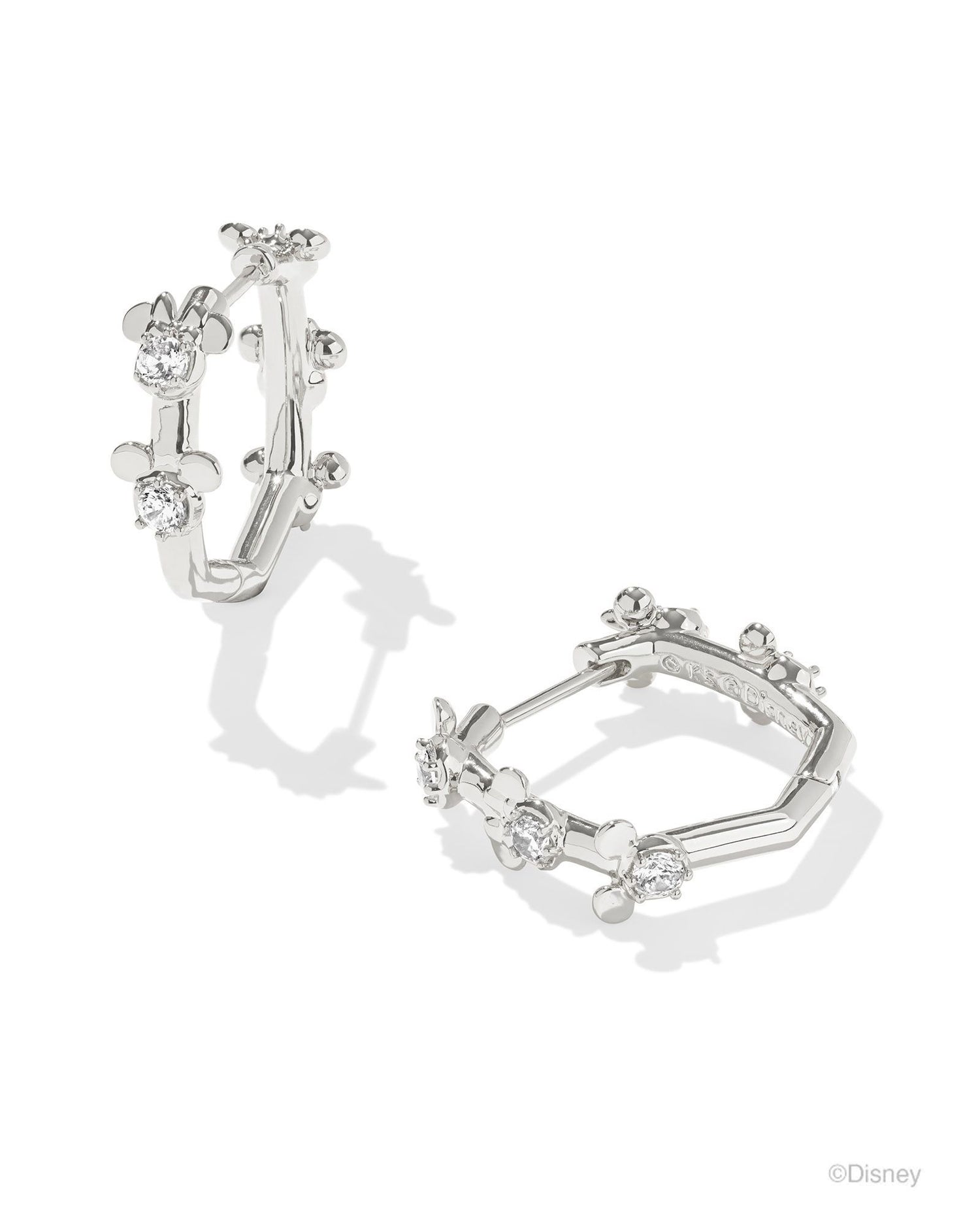 Crystal studded alternating "Mickey" and "Minnie" small head pendants. Silver huggie earrings