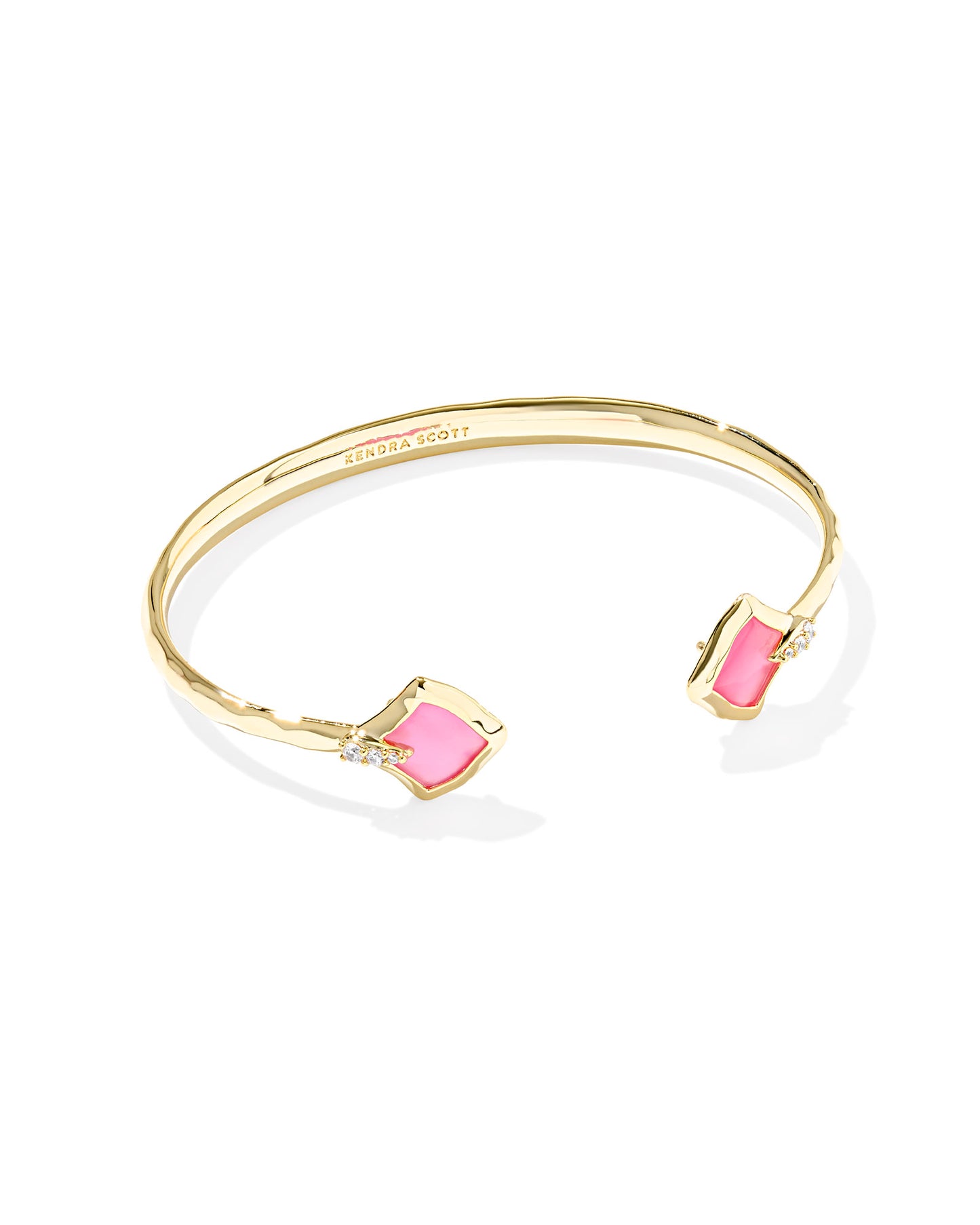 Gold cuff bracelet. Alexandra shaped (diamond shape) azalea illusion (pink) at the end of each side.
