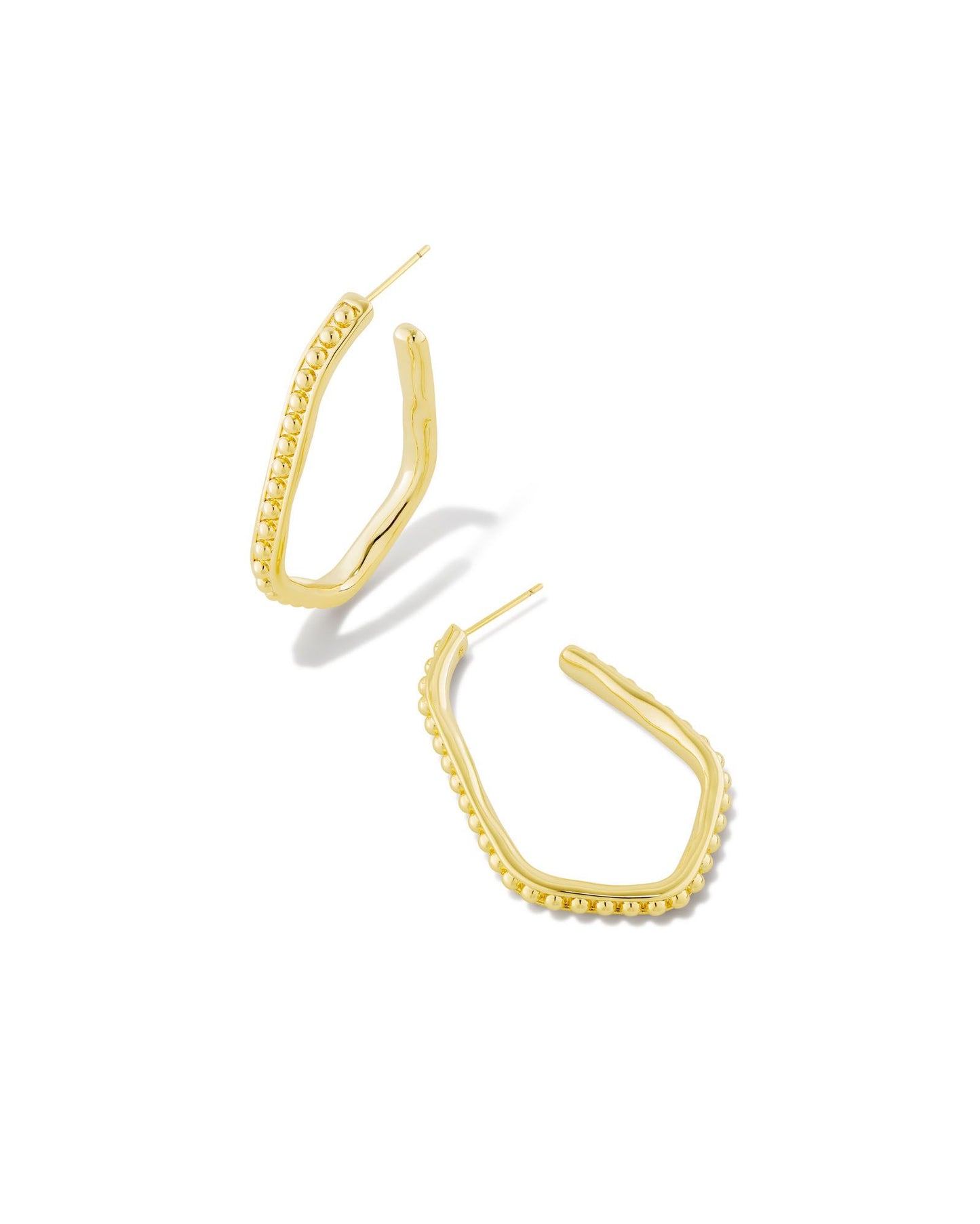 This eye-catching elongated hoop design is perfect for shaking up your look. With textured metal beads and a face-framing shape, the Lonnie Beaded Hoop Earrings in Gold go with any sense of style. These are Gold Color