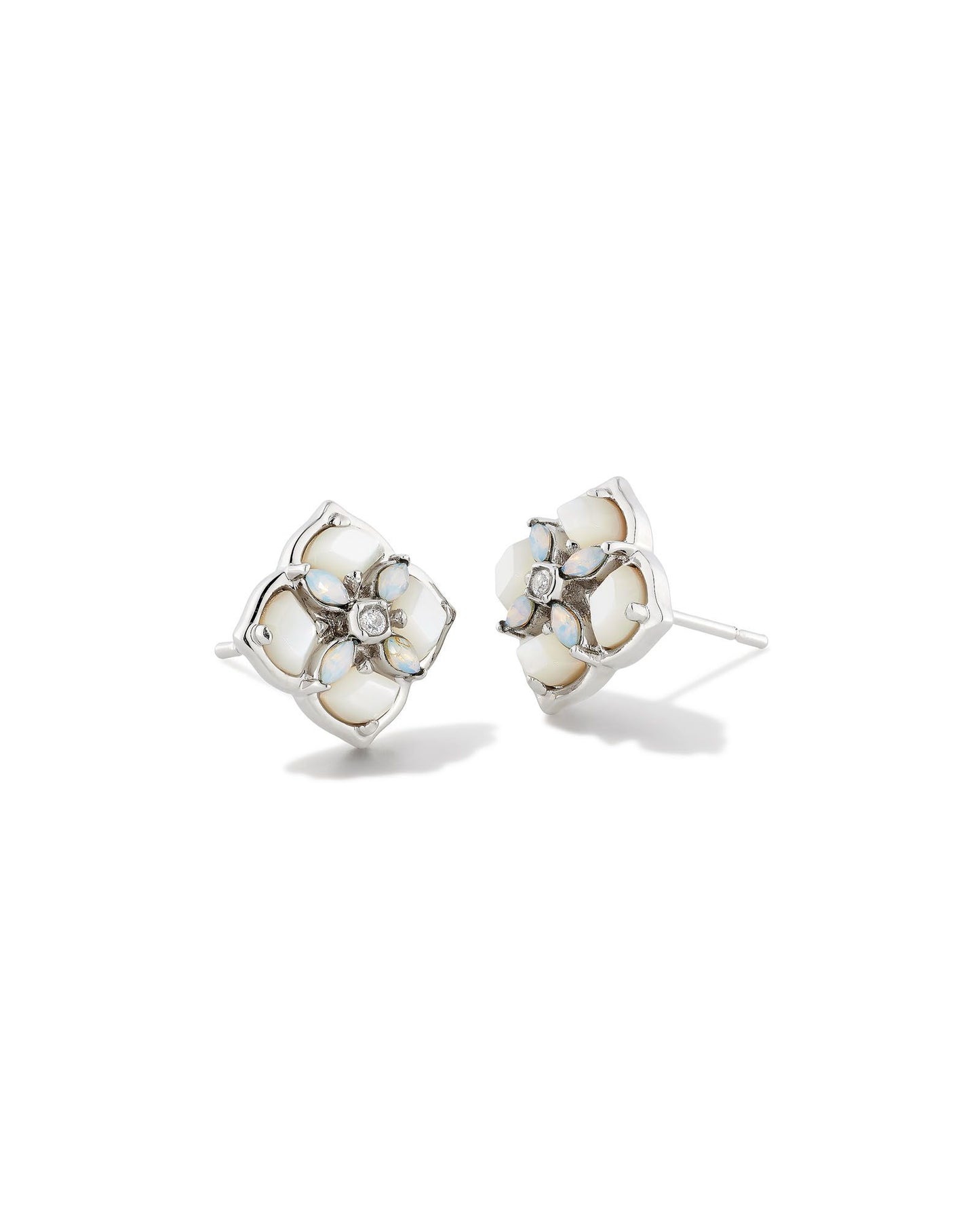 These stud earrings feature subtle stones and gems filled into our logo shape that are sure to lighten up any ensemble. The metal is 24k rhodium plated over brass with white stones. 