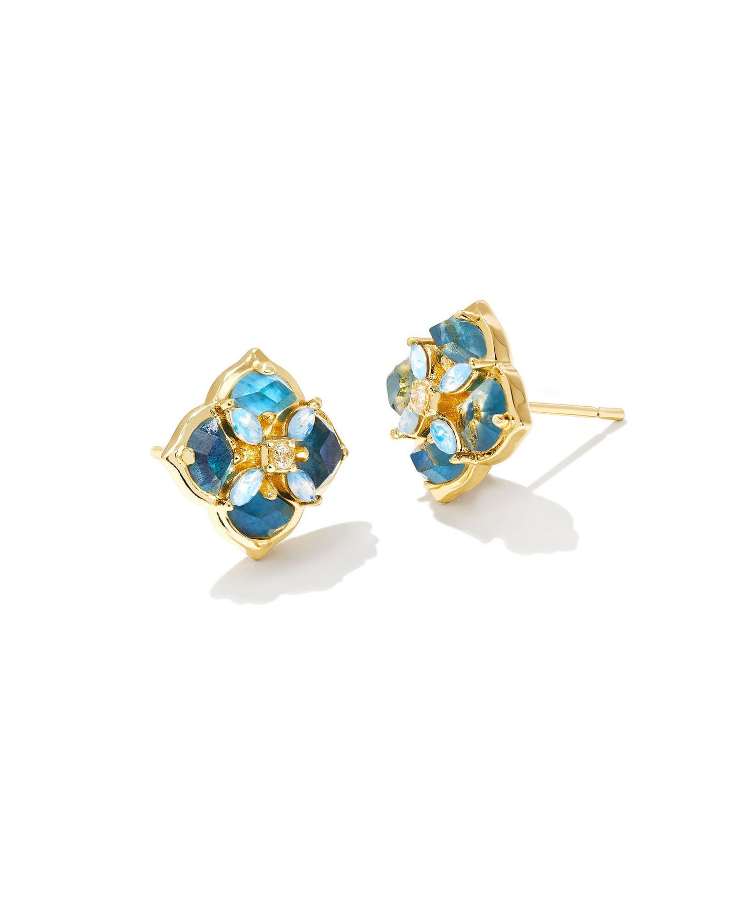 These stud earrings feature subtle stones and gems filled into our logo shape that are sure to lighten up any ensemble. The metal is 24K Gold plated over brass with blue mix stones.