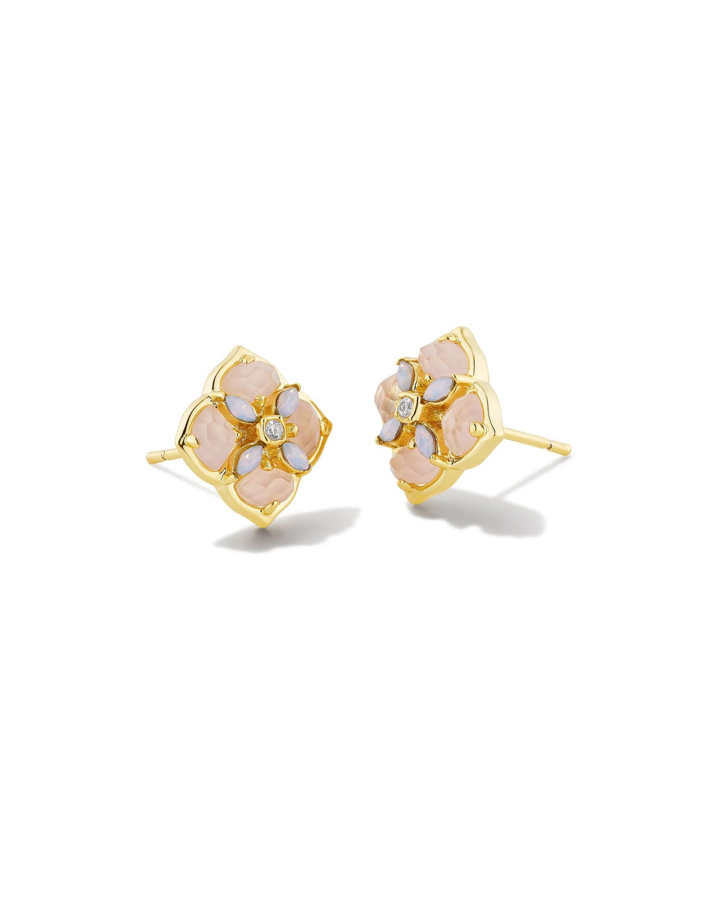 These stud earrings feature subtle stones and gems filled into our logo shape that are sure to lighten up any ensemble. The metal is 24k gold plated over brass with rose mother of pearl stones. 