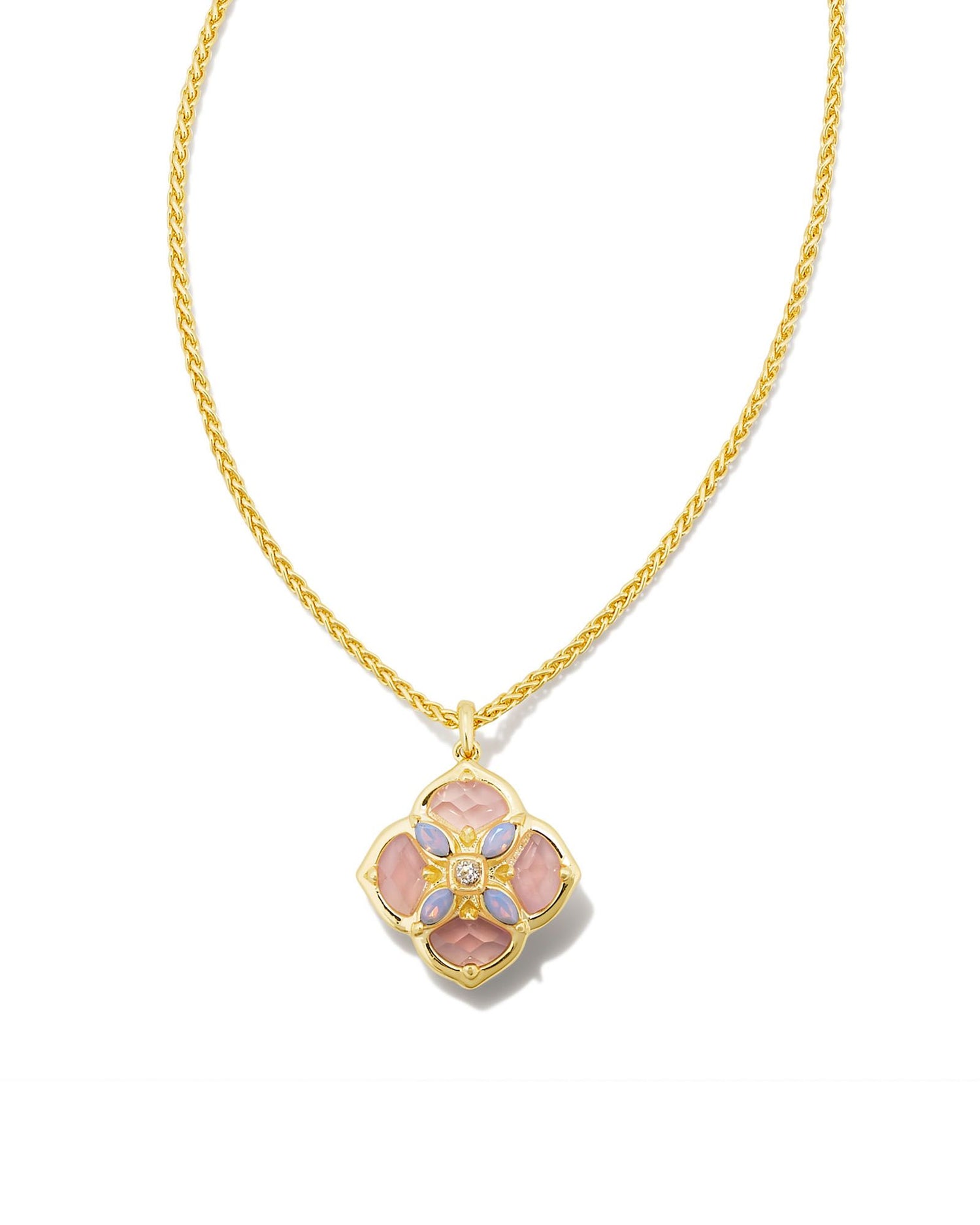 Our signature logo meets gorgeous stone detailing for the first time in the Dira Stone Gold Short Pendant Necklace. Featuring custom-cut stones and gems assembled into our logo shape, this pendant is bound to be a new favorite in your collection. The metal is 24k gold plated over brass with rose colored stones. 