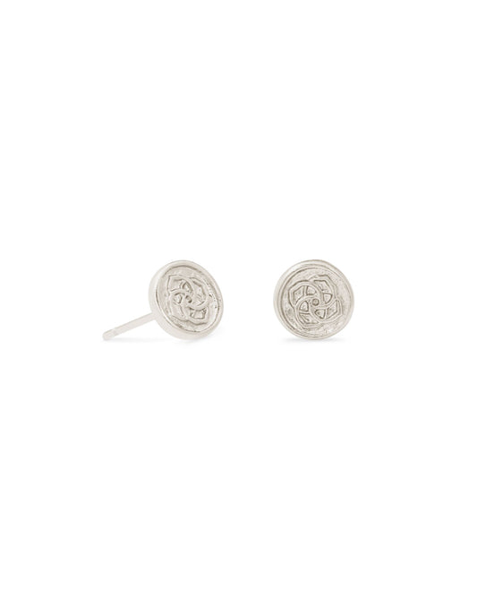 Small silver stud earrings in a circle shape with medallion imprint in the center