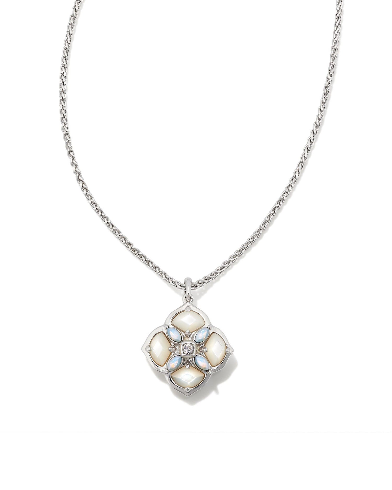Our signature logo meets gorgeous stone detailing for the first time in the Dira Stone Gold Short Pendant Necklace. Featuring custom-cut stones and gems assembled into our logo shape, this pendant is bound to be a new favorite in your collection. The metal is 24k rhodium plated over brass with white stones. 