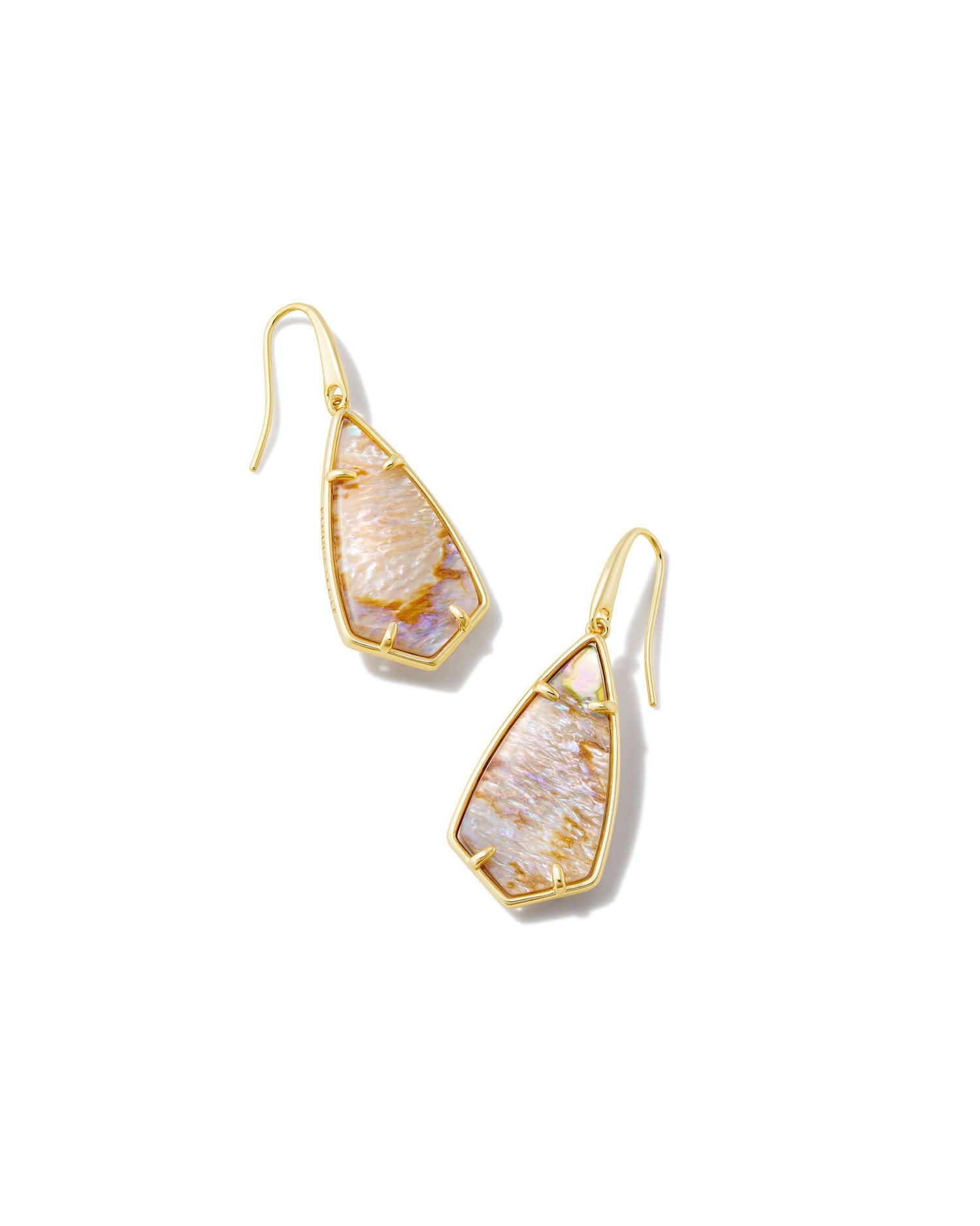With their elongated, face-framing silhouette, the Camry Gold Drop Earrings look good on everyone. Featuring our archival Camry stone shape with a sleek new metal frame, these earrings add the finishing touch to any outfit. This metal is 24k gold plated over brass with sandstone mother of pearl stones. 