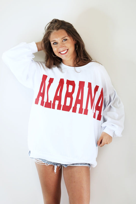 Dixie Land Delightful Alabama Jersey Top Crew Neckline Long Sleeve White Color "ALABAMA" Print in Crimson Color Relaxed Fit Full Length Side Slits at the Hem 95% Cotton, 5% Spandex