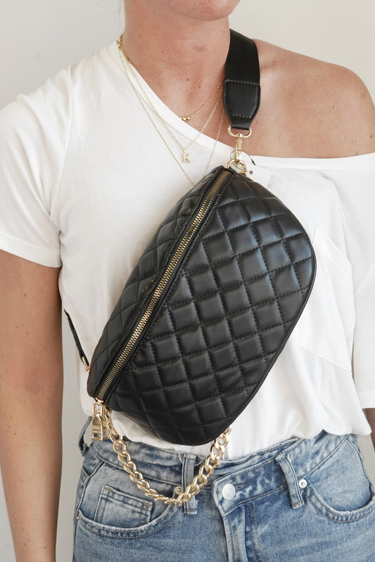 Sylvie Quilted Vegan Leather Bum Bag Removable Crossbody or Belt Strap Back Zipper Pocket Small Inner Zipper Pocket Ten Card Slots Gold Chain Detail Approx 10 1/2 in x 6 1/2 in x 4 in. black color