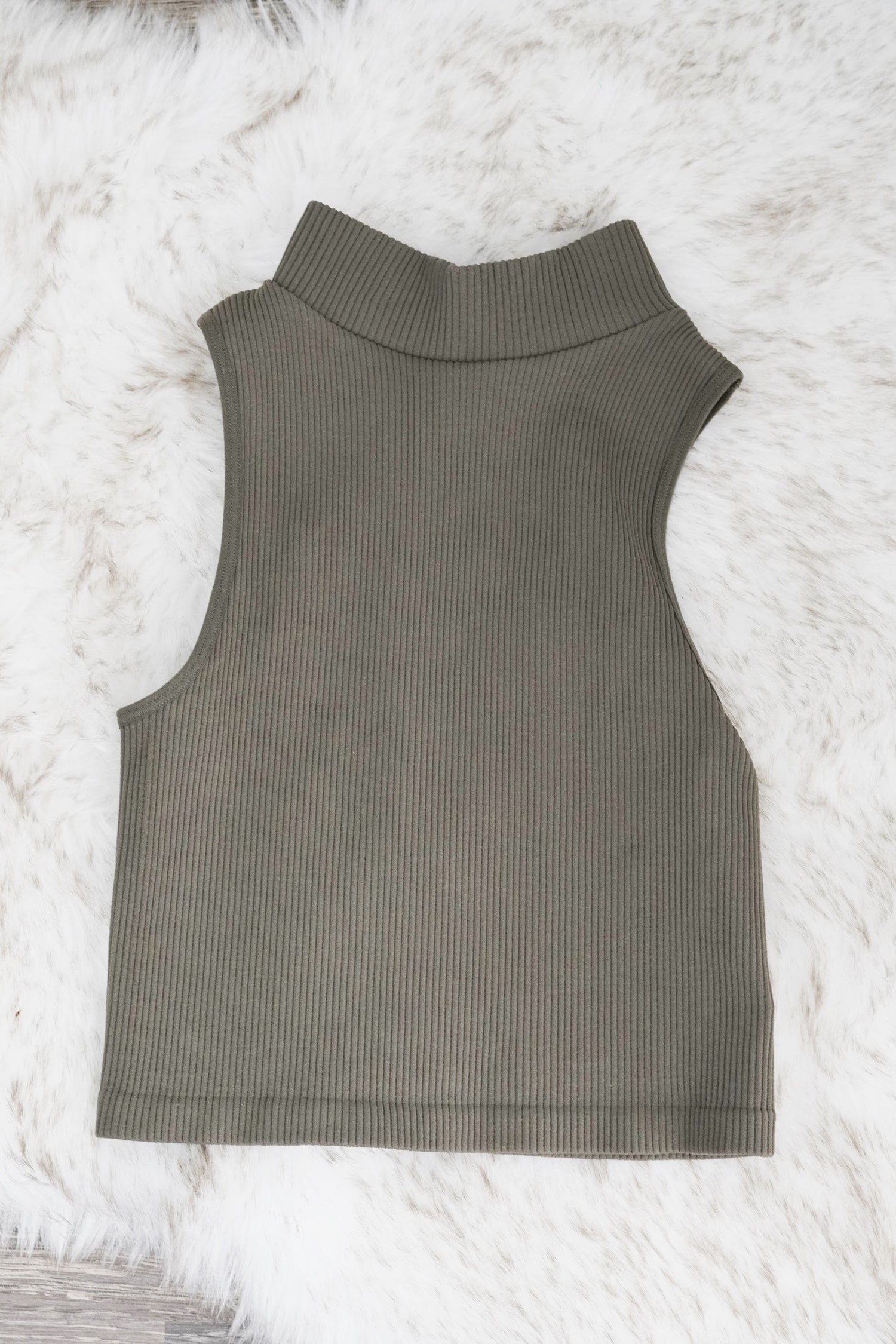 Mer Mock Neck Sleeveless Top Mock Neckline Sleeveless Ribbed Material Colors: Olive Fitted Cropped 92% Nylon, 8% Spandex