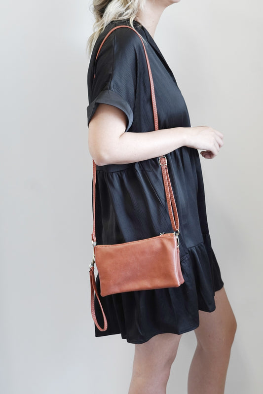 Riley Neutral Crossbody Wallet 5 Compartments 6 Card Slots  1 Interior Zipper  Zipper Closer   Colors: Rust One Crossbody Strap, One Wristlet Strap - Both Removable 8.5 x 5.5in
