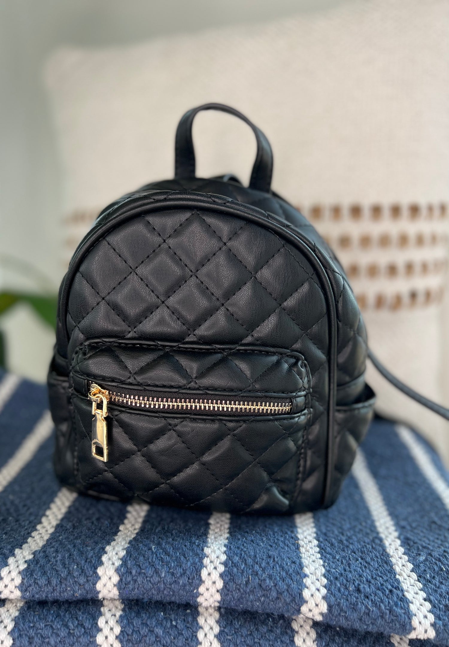 Black quilted 2024 mini backpack