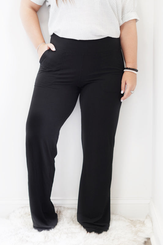 Sawyer Straight Leg Butter Soft Yoga Pants High Waisted Wide Yoga Pants Pockets on sides Color/Black Full Length 84% Poly Microfiber, 16% Spandex Wash with like colors Model is wearing a size medium