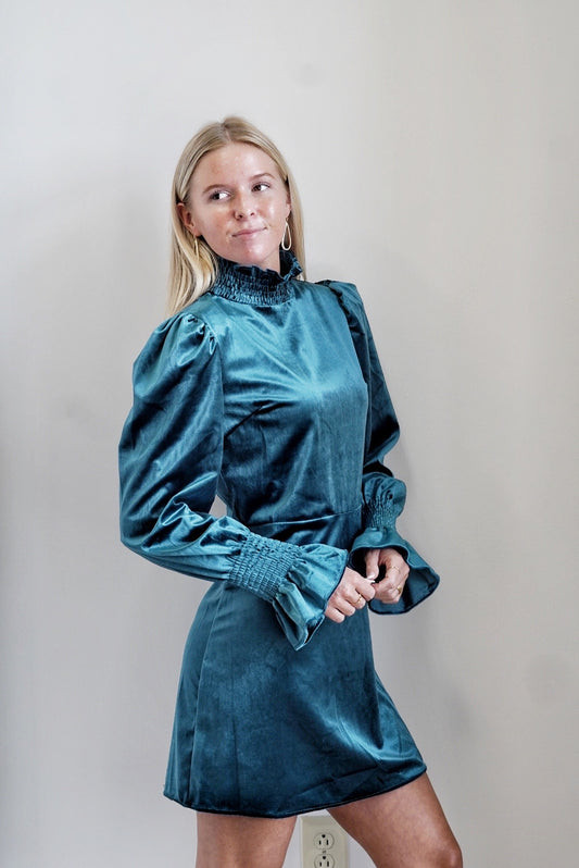 Cecelia Smocked Neck Dress Smocked Mock Neckline Velvet Material Long Sleeves w/ Smocked Cuffs Teal Color Knee Length Relaxed Fit 100% Polyester