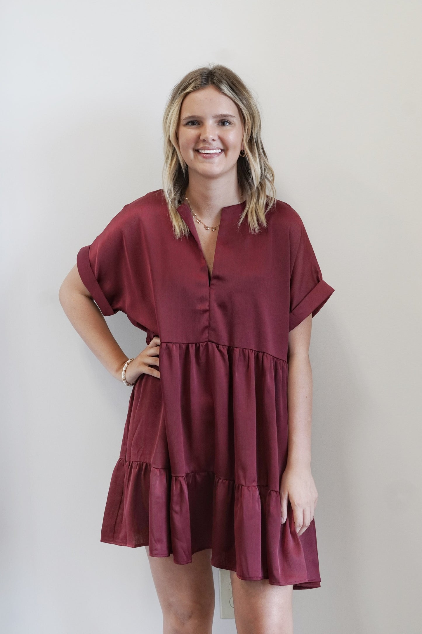 Teresa Tiered Ruffle Dress V-Neckline Short Cuffed Hem Sleeves Tiered Ruffle Style Colors: Burgundy Relaxed Fit Knee Length 100% Polyester