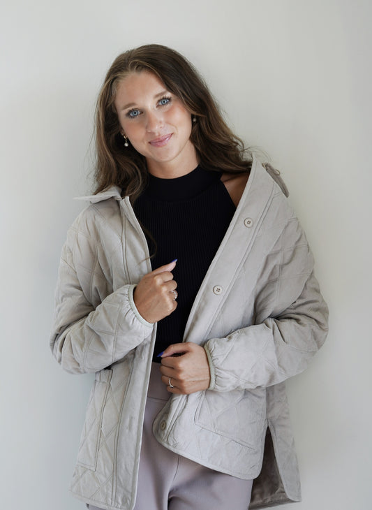 Calla Cozy Front Pocket Quilted Jacket Collared Neckline Long Sleeves Quilted Fabric Front Pockets Buttons Mild Stone Color Relaxed Fit 100% Polyester