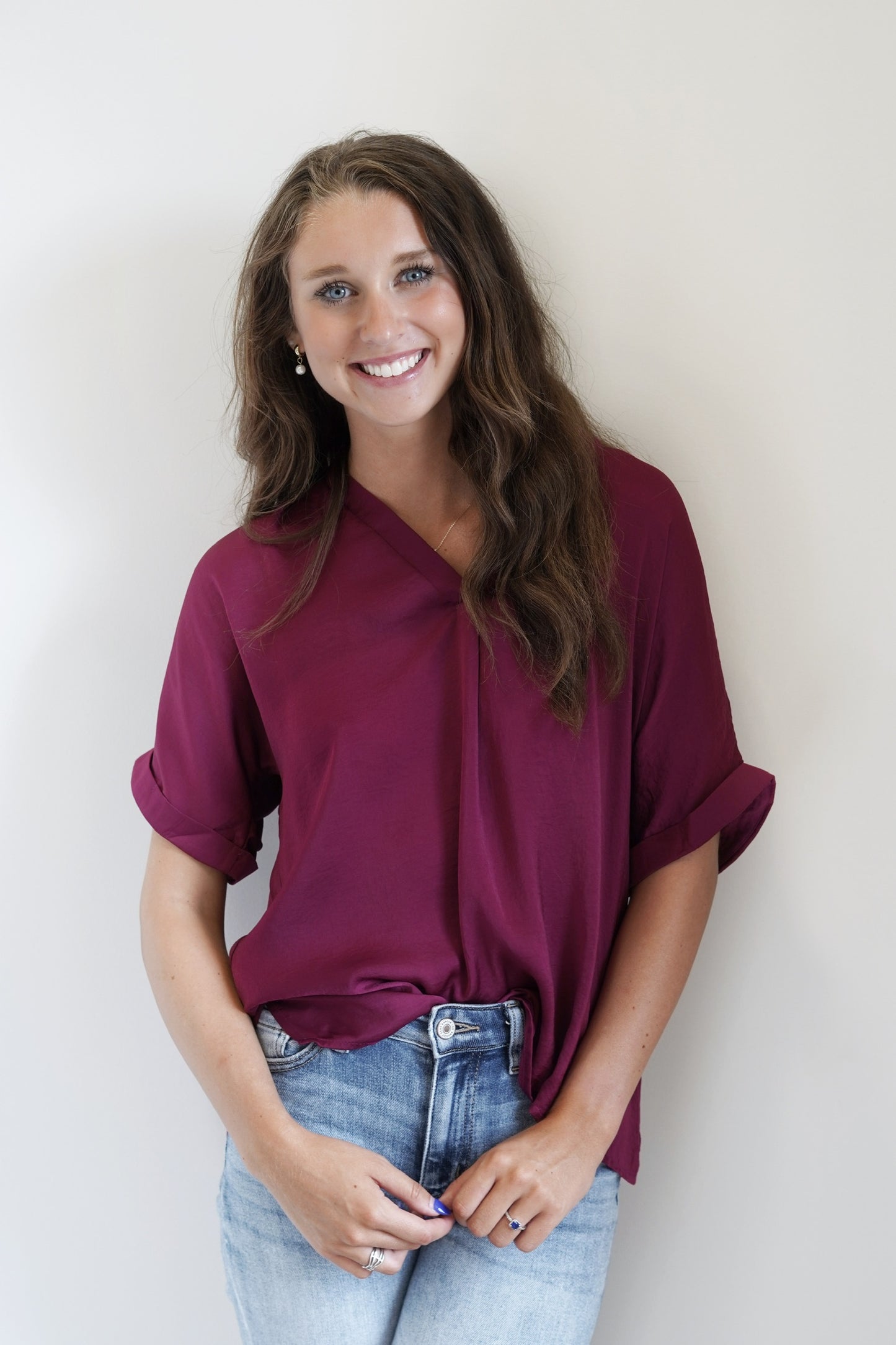 The Priscilla Perfect Sleek Blouse Deep V-Neckline Cuffed Short Sleeves Plum Full Length Relaxed Fit 100% Polyester 