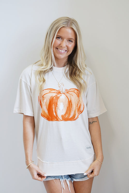 Delilah Orange Pumkin T-Shirt Crew Neckline Short Sleeves Orange Pumkin Distressed T-Shirt Color: Toasted Vanilla Full Length Side Slits On Bottom Of Shirt 55% Cotton, 45% Polyester