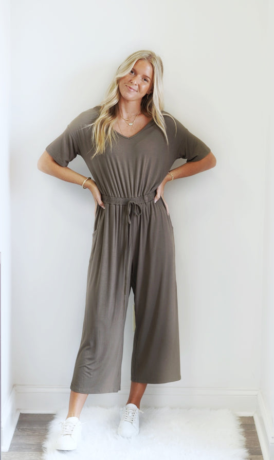 Emily Short Sleeve Jersey Jumpsuit  V-Neckline Dolman Sleeve Line Elastic Waist  Loose Fit Cut Cotton Blend Knit Fabric  Olive Color Available In Extra Large Care: 95% Rayon, 5% Spandex Hand Wash Cold Do Not Bleach, Lay Flat To Dry, Low Iron If Needed Model Is Wearing Size Small