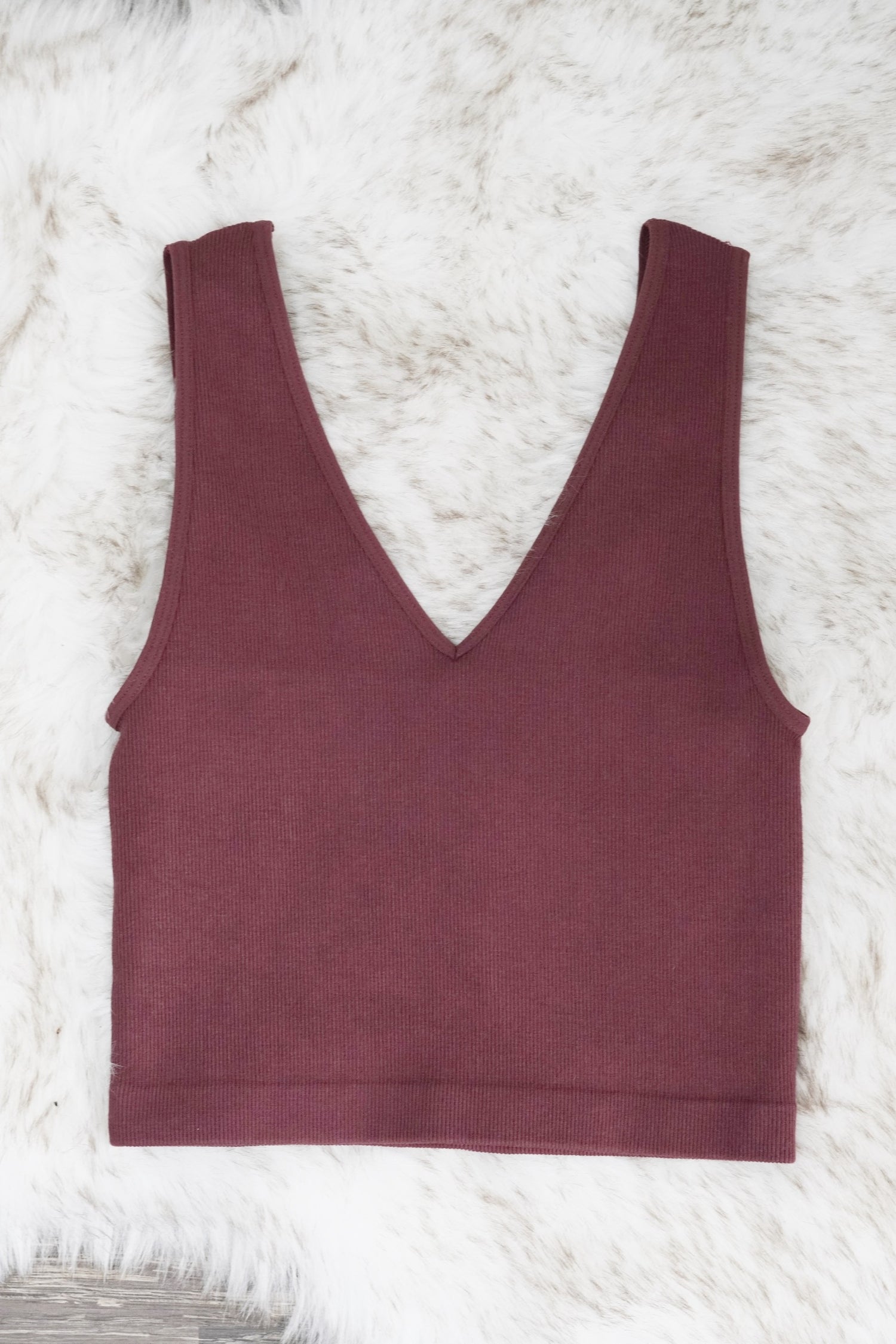 Beautiful basic Cropped Tank V-Neckline Sleeveless Ribbed Material Colors Plum Fitted Cropped 72% Modal, 24% Nylon, 4% Spandex