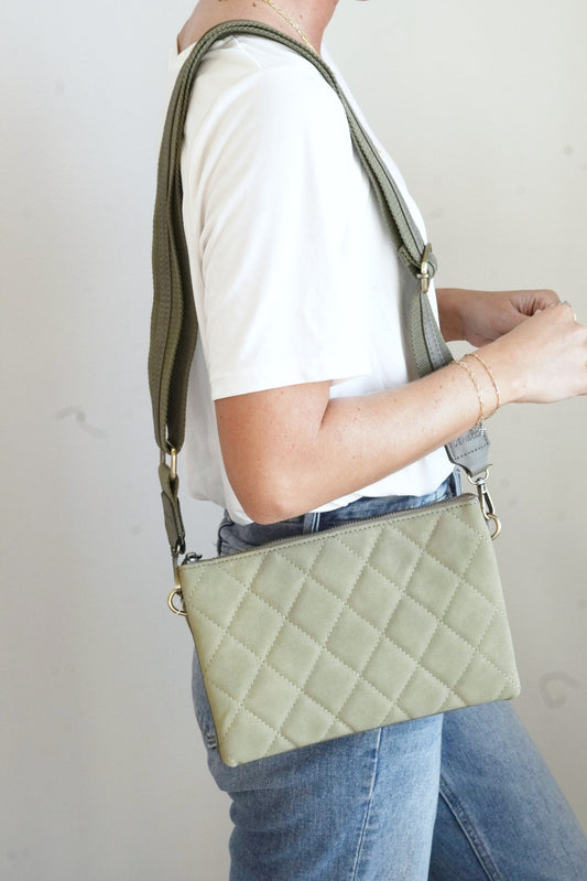 Izzy Quilted Oversized Crossbody Wallet Quilted Pattern Expandable Two Large Inner Pockets Middle Zipper Pocket Six Credit Card Slots Removeable Adjustable Guitar Strap and Wrist Strap Approx 10 in. x 6 1/2 in. x 1 1/2 in. Bottom expands to approx. 5 in. olive color