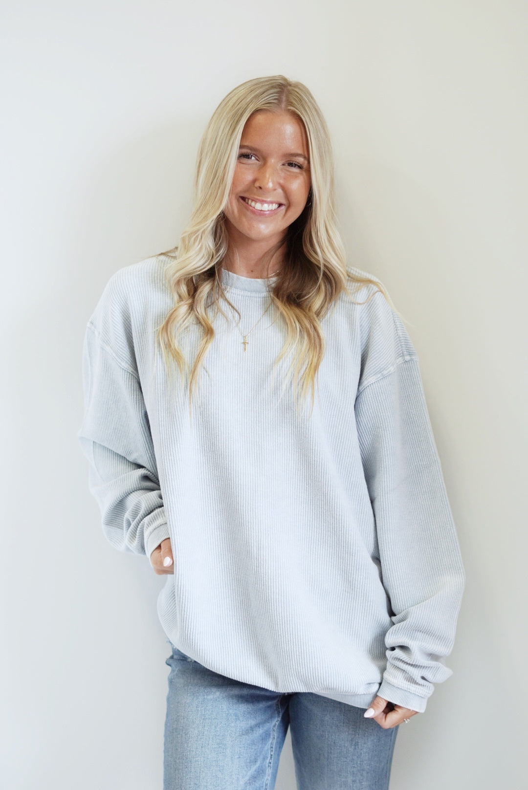 Calla Corded Crew Everyday Sweatshirt Crew Neckline Long Sleeve Corded Material Colors: Pink, Ivory, Sky Blue Full Length Relaxed Fit 100% Cotton Care: Machine Wash Carefully in Cold Water, Lay Flat to Dry