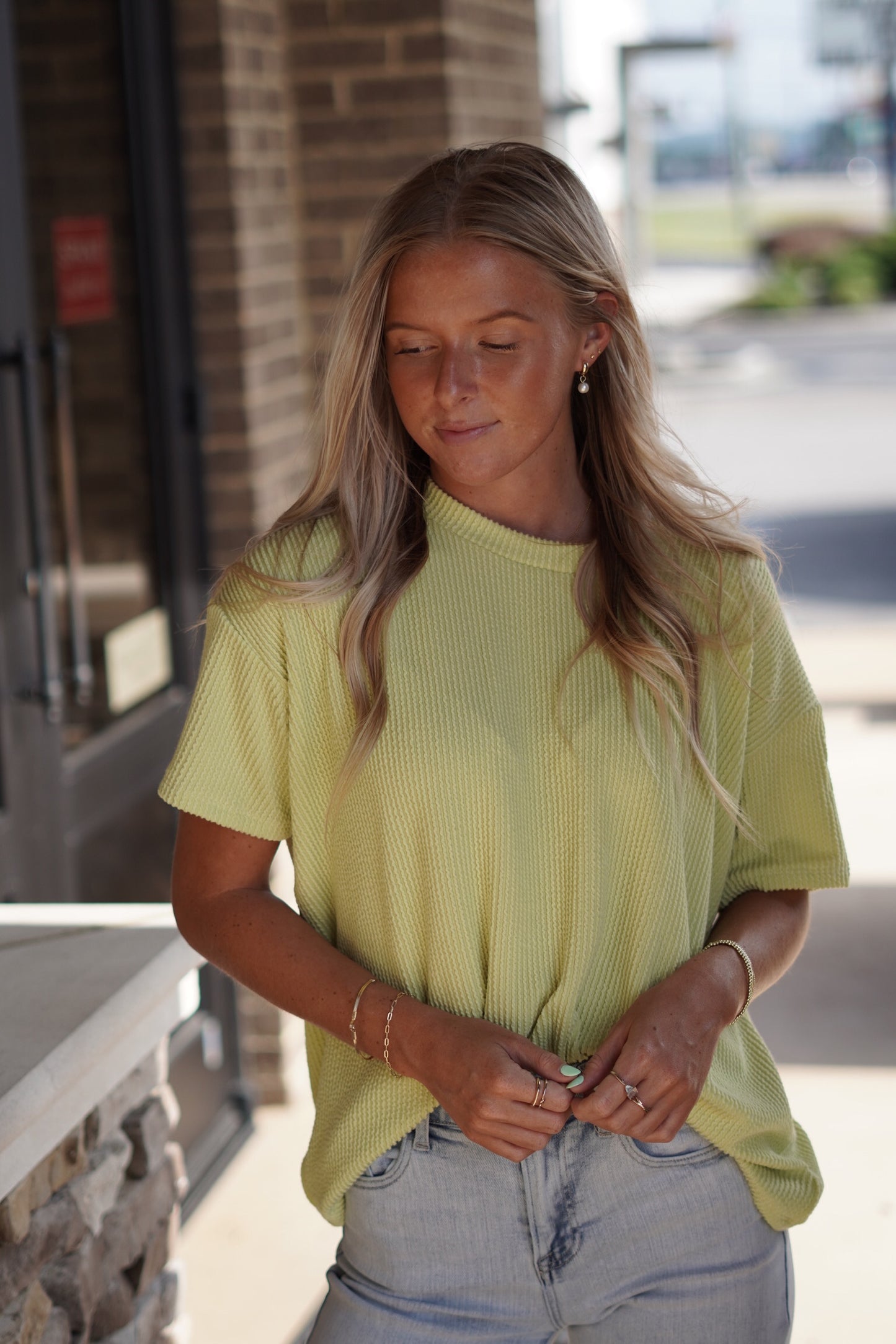 Grace Relaxed Rib Top Round Neck Short Sleeves Color: Lime 76% Polyester, 21% Rayon, 3% Spandex Hand Was Cold, Do not Bleach, Hand Or Line Dry Model is wearing size: Small
