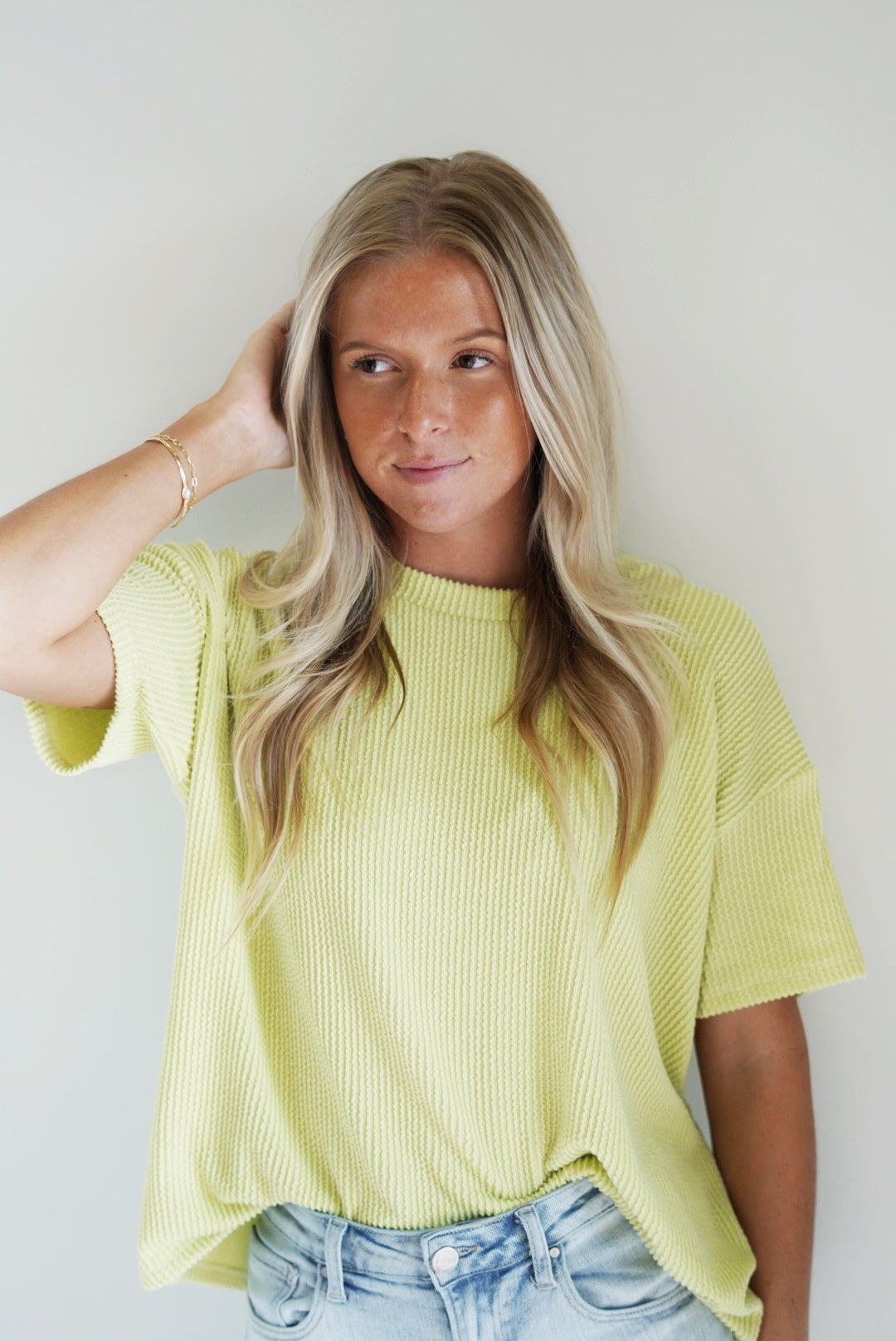 Grace Relaxed Rib Top Round Neck Short Sleeves Color: Lime 76% Polyester, 21% Rayon, 3% Spandex Hand Was Cold, Do not Bleach, Hand Or Line Dry Model is wearing size: Small